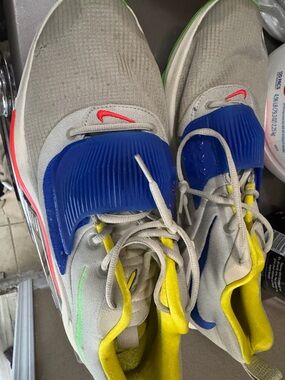 Nike Kids Beige Sneakers with Blue, Yellow & Red Accents